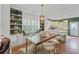 Open dining area features custom built-in shelving with bench seating and a modern table with seating for six at 404 Forsythia Ave, Summerville, SC 29483