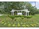 Welcoming entrance to White Gables community with lush landscaping and an elegant white pergola at 404 Forsythia Ave, Summerville, SC 29483