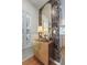 Entryway with patterned wallpaper, a stylish wood cabinet and matching gold mirror at 404 Forsythia Ave, Summerville, SC 29483