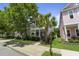 Charming two-story home with a welcoming front porch and a beautifully landscaped yard at 404 Forsythia Ave, Summerville, SC 29483