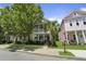 Charming two-story homes featuring well-manicured lawns and inviting double porches at 404 Forsythia Ave, Summerville, SC 29483