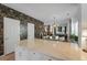 Bright open-concept kitchen with marble island, connecting the living spaces, and creating a warm, inviting atmosphere at 404 Forsythia Ave, Summerville, SC 29483