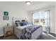 Cozy bedroom features a large window letting in natural light and decorative bed coverings at 408 Trevi Ln, Summerville, SC 29486