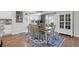 Dining area with hardwood floors, bright window, and stylish decor at 408 Trevi Ln, Summerville, SC 29486