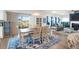 Open-concept dining area with hardwood floors and views into the backyard through sliding glass doors at 408 Trevi Ln, Summerville, SC 29486