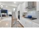 Modern kitchen with stainless steel appliances and views to the living area and hardwood floors at 408 Trevi Ln, Summerville, SC 29486