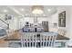 Modern kitchen featuring white cabinets and stainless steel appliances, adjoining dining area at 408 Trevi Ln, Summerville, SC 29486