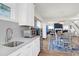 Modern kitchen featuring bright countertops and backsplash, view to dining and living area at 408 Trevi Ln, Summerville, SC 29486