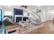 Inviting living room featuring a fireplace, comfortable seating, and a staircase leading to the upper level at 408 Trevi Ln, Summerville, SC 29486