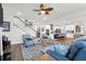 Open-concept living area with stairs, hardwood floors, and plenty of natural light at 408 Trevi Ln, Summerville, SC 29486