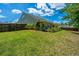 Well-maintained backyard with a wooden fence, patio, lawn, and pergola providing an outdoor living space at 409 Carousel Ct, Summerville, SC 29483