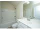 Bright bathroom featuring a shower-tub combo and a white vanity with a large mirror at 409 Carousel Ct, Summerville, SC 29483