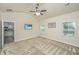 Spacious bedroom featuring a ceiling fan, plush carpet, and access to the kitchen, offering comfort and convenience at 409 Carousel Ct, Summerville, SC 29483