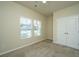 Bright bedroom with plush carpet, a ceiling fan, and large windows showcasing neighborhood views at 409 Carousel Ct, Summerville, SC 29483