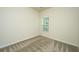 Cozy bedroom with plush carpet, a window, and a soothing neutral color scheme at 409 Carousel Ct, Summerville, SC 29483
