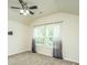 Bedroom featuring carpeted floors, a ceiling fan, and two windows with gray gradient curtains at 409 Carousel Ct, Summerville, SC 29483