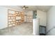 Bonus room with custom shelving, neutral carpet, and a staircase to access lower floors at 409 Carousel Ct, Summerville, SC 29483