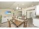 Cozy dining space with views into the kitchen and living area, ideal for Gathering meals and entertaining guests at 409 Carousel Ct, Summerville, SC 29483