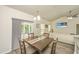 Inviting dining area featuring a wooden table, comfortable seating, and access to the outdoor patio, perfect for gatherings at 409 Carousel Ct, Summerville, SC 29483