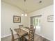 Charming dining area with natural light, a neutral color scheme, and a view to the outdoor patio at 409 Carousel Ct, Summerville, SC 29483