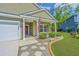 Inviting front entrance with a well-manicured lawn, charming walkway, and a cozy front porch at 409 Carousel Ct, Summerville, SC 29483
