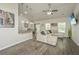 Cozy living room with comfortable seating, a ceiling fan, and great natural lighting at 409 Carousel Ct, Summerville, SC 29483