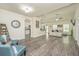 Spacious living room with wood floors, stylish furniture, and ample natural light at 409 Carousel Ct, Summerville, SC 29483