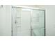 Modern bathroom showcasing a glass-enclosed shower with chrome fixtures and clean, white tile at 409 Carousel Ct, Summerville, SC 29483