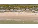 Panoramic aerial view of the beach, ocean, and the neighborhood with charming beach houses at 412 Palmetto Blvd, Edisto Island, SC 29438