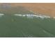 Aerial view of the beach and the ocean waves at 412 Palmetto Blvd, Edisto Island, SC 29438