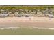 Expansive aerial view of beach homes along the coast with clear ocean waters at 412 Palmetto Blvd, Edisto Island, SC 29438
