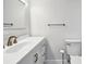 Bathroom featuring a white vanity, bronze hardware, and white beadboard walls at 412 Palmetto Blvd, Edisto Island, SC 29438