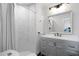 Modern bathroom with tiled shower, gray vanity, and recessed lighting at 412 Palmetto Blvd, Edisto Island, SC 29438