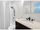 Charming bathroom with white subway tile and a dark vanity at 412 Palmetto Blvd, Edisto Island, SC 29438