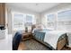 Comfortable bedroom with windows, desk, and an oriental rug at 412 Palmetto Blvd, Edisto Island, SC 29438