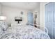 Relaxing bedroom with neutral walls, blue accent door, and a window at 412 Palmetto Blvd, Edisto Island, SC 29438