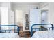 Shared bedroom featuring twin beds and ensuite bathroom at 412 Palmetto Blvd, Edisto Island, SC 29438