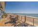 Expansive deck offering sweeping ocean views and a comfortable seating area for relaxation at 412 Palmetto Blvd, Edisto Island, SC 29438