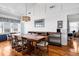 Stylish dining room featuring a large wooden table, hardwood floors, and an elegant chandelier at 412 Palmetto Blvd, Edisto Island, SC 29438