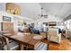 Open-concept dining room with a large wooden table and an abundance of natural light at 412 Palmetto Blvd, Edisto Island, SC 29438