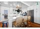 Bright kitchen featuring an island with seating, stainless steel appliances, and overhead pot rack at 412 Palmetto Blvd, Edisto Island, SC 29438