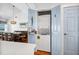 Convenient closet laundry featuring stacked washer and dryer, adjacent to the dining area at 412 Palmetto Blvd, Edisto Island, SC 29438