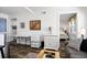 Well-lit living room features white walls, neutral furniture and access to the bedroom at 412 Palmetto Blvd, Edisto Island, SC 29438