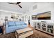 Cozy living room featuring hardwood floors, stylish furnishings, and a vaulted ceiling with ceiling fan at 412 Palmetto Blvd, Edisto Island, SC 29438