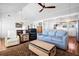 Spacious open-concept living area with hardwood floors, comfortable seating, and abundant natural light at 412 Palmetto Blvd, Edisto Island, SC 29438