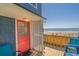 Inviting outdoor shower area with blue accent chairs, next to the beach at 412 Palmetto Blvd, Edisto Island, SC 29438
