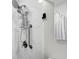 Close-up of the bathroom shower with a grab bar and caddy at 412 Palmetto Blvd, Edisto Island, SC 29438