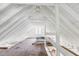A large attic with white ceiling beams and hardwood floors at 4503 Overbrook Ave, North Charleston, SC 29405