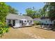 Spacious backyard with a patio, dining table, fire pit, and seating area at 4503 Overbrook Ave, North Charleston, SC 29405