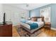 Bright bedroom features a comfortable queen bed, ceiling fan, and light-filled windows at 4503 Overbrook Ave, North Charleston, SC 29405
